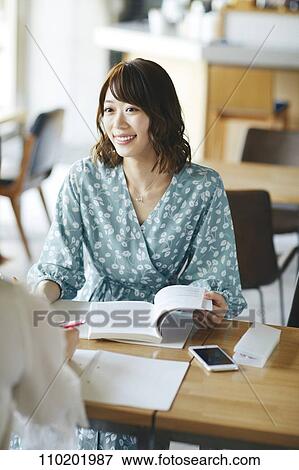 Stock Photo - Young Japanese friends having fun together. Fotosearch