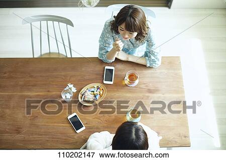 Stock Photo - Young Japanese friends having fun together. Fotosearch