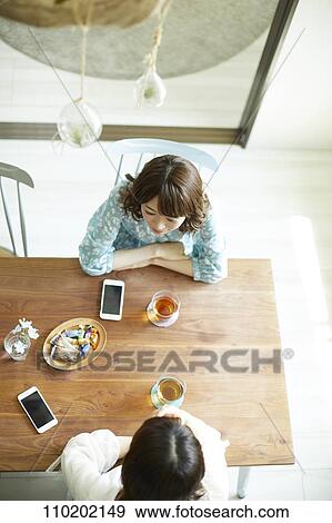 Young Japanese friends having fun together View Large Photo Image Stock Photo - Young Japanese friends having fun together. Fotosearch