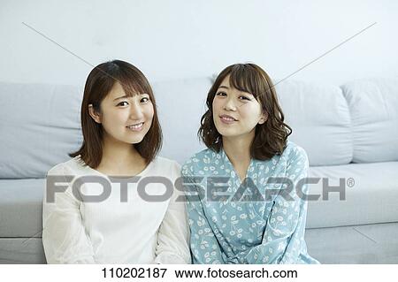 Stock Photo - Young Japanese friends having fun together. Fotosearch