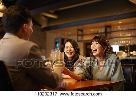 Young Japanese friends having fun together View Large Photo Image Stock Photo - Young Japanese friends having fun together. Fotosearch