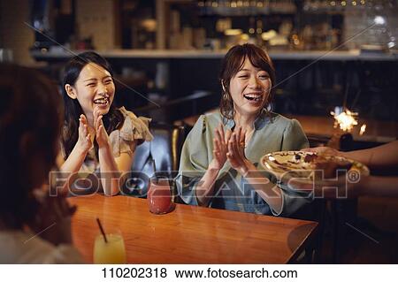Young Japanese friends having fun together View Large Photo Image Stock Photo - Young Japanese friends having fun together. Fotosearch