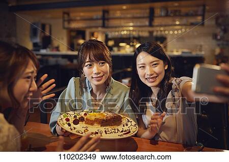Young Japanese friends having fun together View Large Photo Image Stock Photo - Young Japanese friends having fun together. Fotosearch