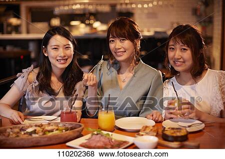 Young Japanese friends having fun together View Large Photo Image Stock Photo - Young Japanese friends having fun together. Fotosearch