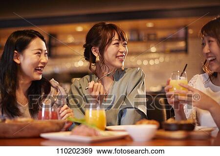 Young Japanese friends having fun together View Large Photo Image Stock Photo - Young Japanese friends having fun together. Fotosearch