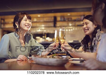 Young Japanese friends having fun together View Large Photo Image Stock Photo - Young Japanese friends having fun together. Fotosearch