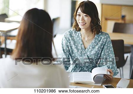 Young Japanese friends having fun together View Large Photo Image Stock Photograph - Young Japanese friends having fun together. Fotosearch