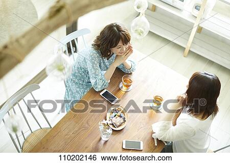 Young Japanese friends having fun together View Large Photo Image Stock Photograph - Young Japanese friends having fun together. Fotosearch