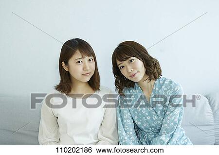 Stock Photograph - Young Japanese friends having fun together. Fotosearch