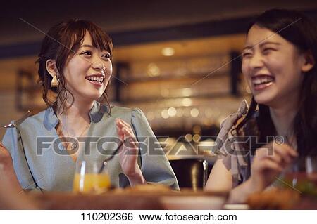Young Japanese friends having fun together View Large Photo Image Stock Photograph - Young Japanese friends having fun together. Fotosearch
