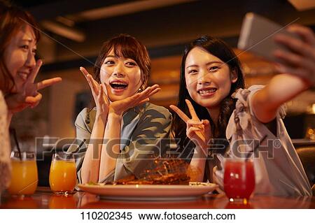 Young Japanese friends having fun together View Large Photo Image Stock Photography - Young Japanese friends having fun together. Fotosearch