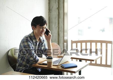 Young Japanese man at a cafe View Large Photo Image Stock Photography - Young Japanese man at a cafe. Fotosearch