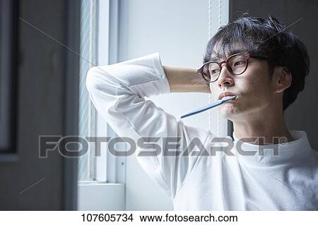 Picture - Young Japanese man portrait. Fotosearch