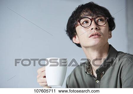 Stock Image - Young Japanese man portrait. Fotosearch
