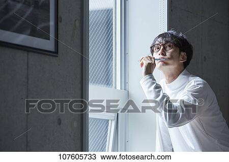 Young Japanese man portrait View Large Photo Image Stock Image - Young Japanese man portrait. Fotosearch