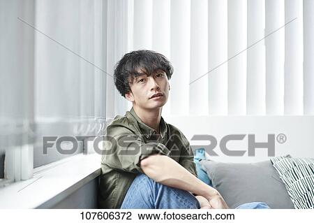 Stock Image - Young Japanese man portrait. Fotosearch