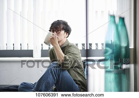 Stock Image - Young Japanese man portrait. Fotosearch