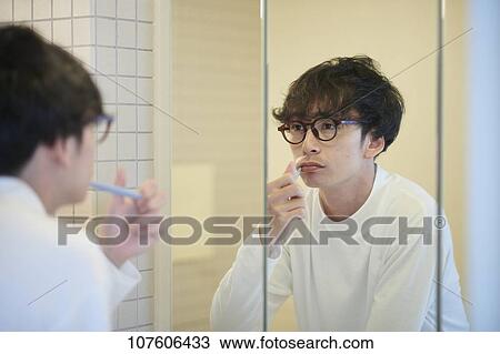 Stock Image - Young Japanese man portrait. Fotosearch