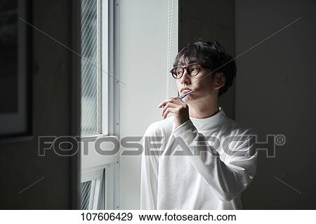 Stock Photo - Young Japanese man portrait. Fotosearch