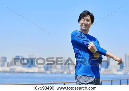 Young Japanese man running downtown Tokyo View Large Photo Image Stock Image - Young Japanese man running downtown Tokyo. Fotosearch