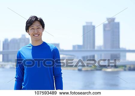 Young Japanese man running downtown Tokyo View Large Photo Image Stock Photo - Young Japanese man running downtown Tokyo. Fotosearch