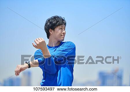 Young Japanese man running downtown Tokyo View Large Photo Image Stock Photo - Young Japanese man running downtown Tokyo. Fotosearch
