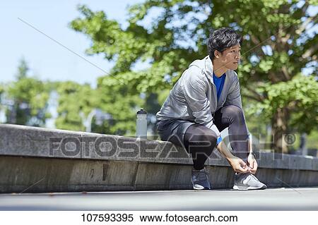 Young Japanese man running downtown Tokyo View Large Photo Image Stock Photography - Young Japanese man running downtown Tokyo. Fotosearch