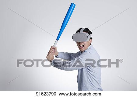 Young Japanese man using VR goggles View Large Photo Image Stock Image - Young Japanese man using VR goggles. Fotosearch