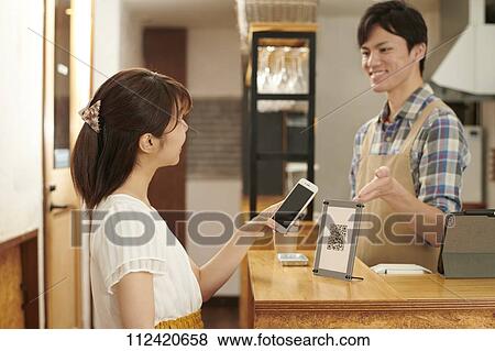 Stock Photo - Young Japanese people at a cafe. Fotosearch