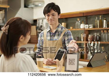 Stock Photograph - Young Japanese people at a cafe. Fotosearch