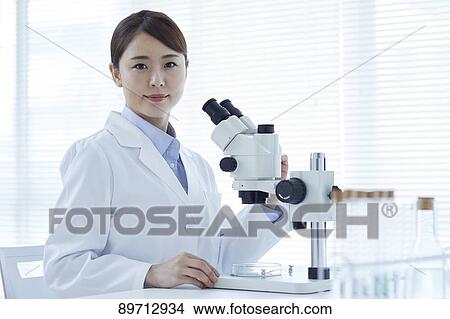Young Japanese researcher in the lab View Large Photo Image Picture - Young Japanese researcher in the lab. Fotosearch