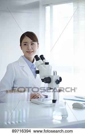 Young Japanese researcher in the lab View Large Photo Image Picture - Young Japanese researcher in the lab. Fotosearch