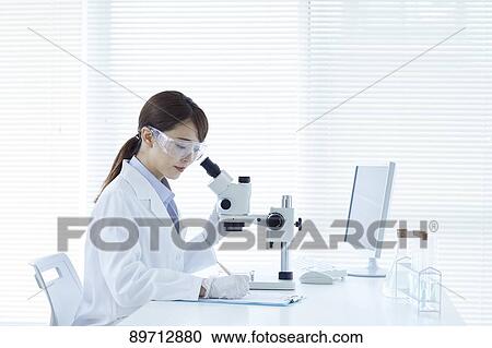 Young Japanese researcher in the lab View Large Photo Image Stock Image - Young Japanese researcher in the lab. Fotosearch