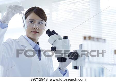 Young Japanese researcher in the lab View Large Photo Image Stock Image - Young Japanese researcher in the lab. Fotosearch