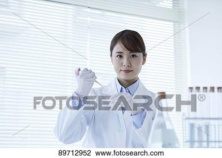 Young Japanese researcher in the lab View Large Photo Image Stock Image - Young Japanese researcher in the lab. Fotosearch