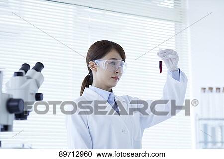 Young Japanese researcher in the lab View Large Photo Image Stock Image - Young Japanese researcher in the lab. Fotosearch