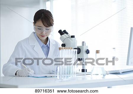 Young Japanese researcher in the lab View Large Photo Image Stock Image - Young Japanese researcher in the lab. Fotosearch