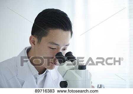Young Japanese researcher in the lab View Large Photo Image Stock Image - Young Japanese researcher in the lab. Fotosearch
