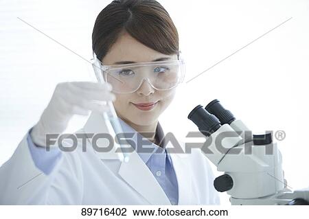 Young Japanese researcher in the lab View Large Photo Image Stock Image - Young Japanese researcher in the lab. Fotosearch