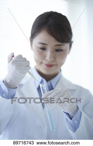Young Japanese researcher in the lab View Large Photo Image Stock Image - Young Japanese researcher in the lab. Fotosearch
