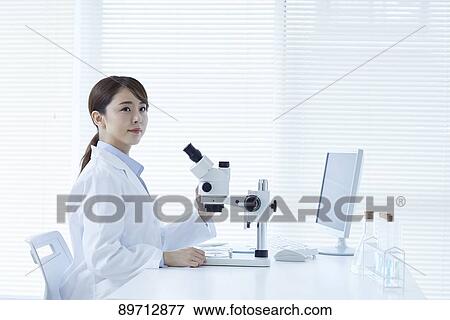 Young Japanese researcher in the lab View Large Photo Image Stock Photo - Young Japanese researcher in the lab. Fotosearch