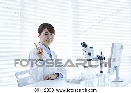 Young Japanese researcher in the lab View Large Photo Image Stock Photo - Young Japanese researcher in the lab. Fotosearch