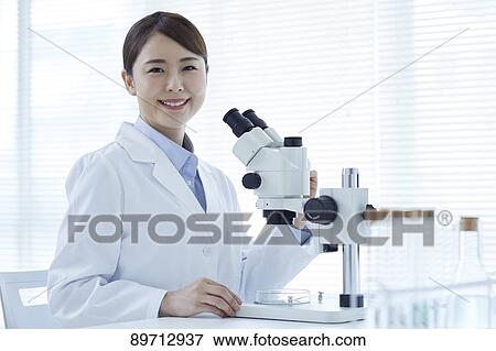 Young Japanese researcher in the lab View Large Photo Image Stock Photo - Young Japanese researcher in the lab. Fotosearch