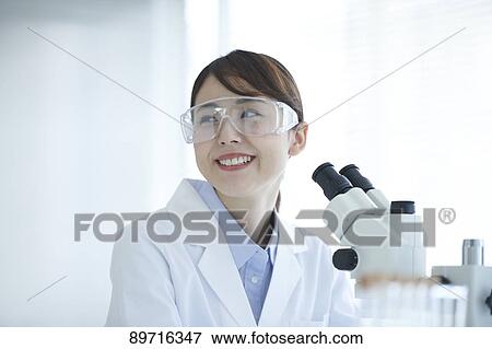 Young Japanese researcher in the lab View Large Photo Image Stock Photo - Young Japanese researcher in the lab. Fotosearch