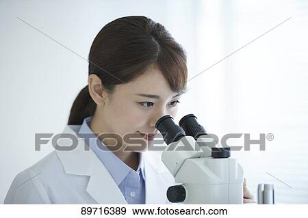 Young Japanese researcher in the lab View Large Photo Image Stock Photo - Young Japanese researcher in the lab. Fotosearch