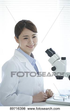 Young Japanese researcher in the lab View Large Photo Image Stock Photo - Young Japanese researcher in the lab. Fotosearch