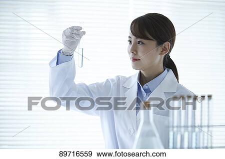 Young Japanese researcher in the lab View Large Photo Image Stock Photo - Young Japanese researcher in the lab. Fotosearch
