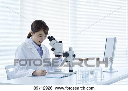 Young Japanese researcher in the lab View Large Photo Image Stock Photograph - Young Japanese researcher in the lab. Fotosearch