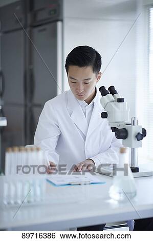 Young Japanese researcher in the lab View Large Photo Image Stock Photograph - Young Japanese researcher in the lab. Fotosearch
