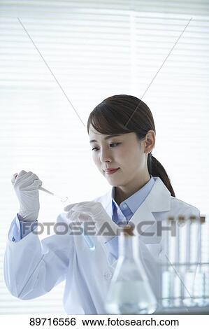Young Japanese researcher in the lab View Large Photo Image Stock Photograph - Young Japanese researcher in the lab. Fotosearch